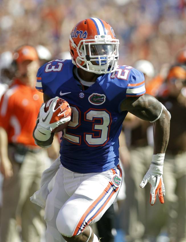 Florida's Mike Gillislee runs with the ball for a 38-yard touchdown against Bowling Green during the first half of an NCAA college football game Saturday, Sept. 1, 2012, in Gainesville, Fla.