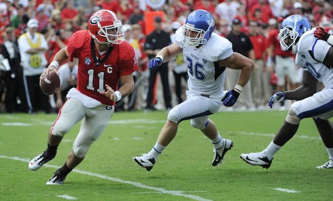 Georgia quarterback Aaron Murray (11)is pursued by Buffalo linebacker Lee Skinner (36) during an NCAA college football game, in Athens, Ga., Saturday, Sept. 1, 2012.