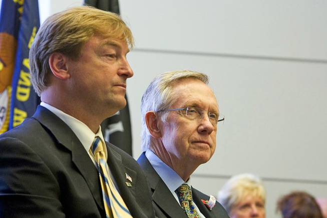 Sens. Dean Heller, left, and Harry Reid attend a Memorial Day ceremony in Boulder City on May 30, 2011.