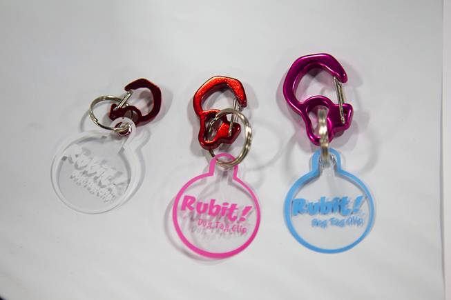 Rubit! pet tag clips are displayed during SuperZoo, a trade show for the pet industry, at the Mandalay Bay Convention Center Tuesday, Sept. 11, 2012. The carabiner-style clips let pet owners easily remove and change their pet's ID tags.