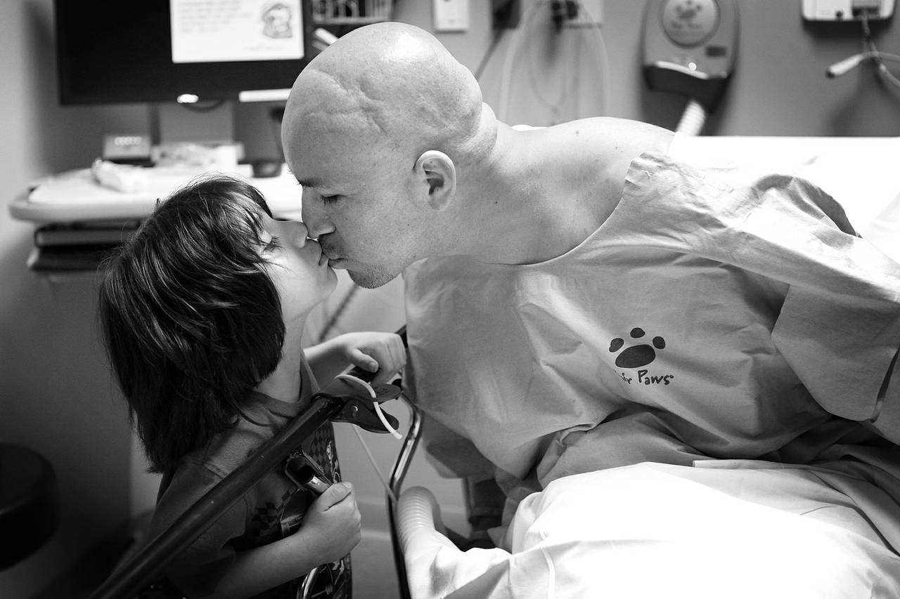 Arturo Martinez-Sanchez kisses his son, Alejandro, 5, before going in for surgery to repair his skull Sept. 12, 2012 at Valley Hospital in Las Vegas.