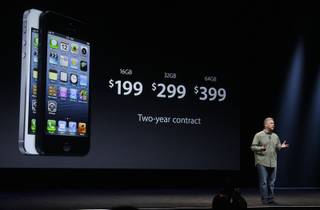 Phil Schiller, Apple's senior vice president of worldwide marketing, gives prices of the iPhone 5 during an Apple event in San Francisco, Wednesday, Sept. 12, 2012. 