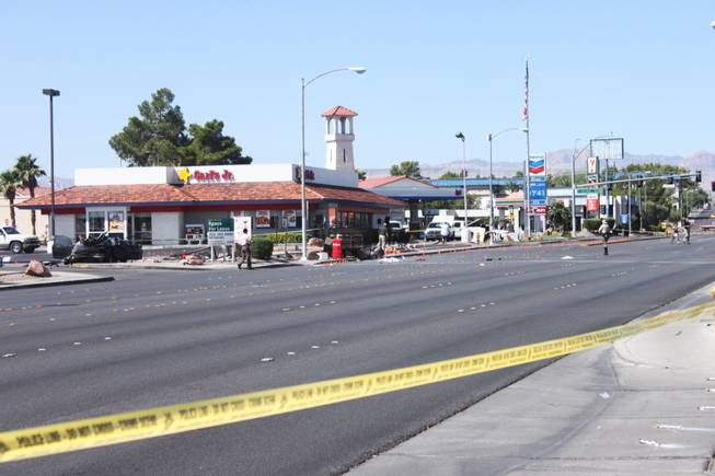 The aftermath of an accident in which a car hit a bus stop that left four dead and eight injured is seen on Spring Mountain Road east of Decatur Boulevard on Thursday, Sept. 13, 2012.