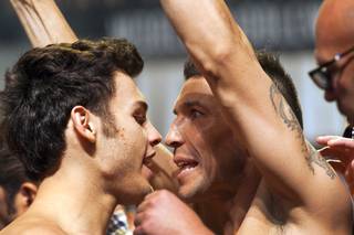 WBC middleweight champion Julio Cesar Chavez Jr. (L), son of boxing legend Julio Cesar Chavez, and Sergio Martinez of Argentina face off during an official weigh-in at the Wynn Las Vegas Resort in Las Vegas, Nevada Sept. 14, 2012. Chavez will defend his title against Martinez at the Thomas & Mack Center in Las Vegas September 15.