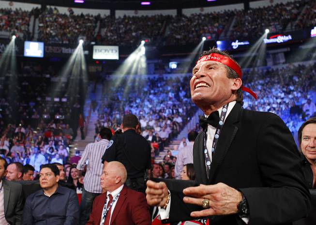 Retired boxer Julio Cesar Chavez urges on his son Julio Cesar Chavez Jr. as he fights against Sergio Martinez during their title fight at the Thomas & Mack Center in Las Vegas, Nevada Sept. 15, 2012.