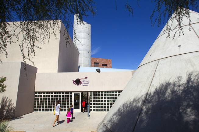 A family heads into the Lied Discovery Children's Museum, part of the Cultural Corridor, in downtown Las Vegas Sunday, Sept. 16, 2012.