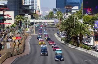 A Bugatti Veyron sports car leads a classic car parade on the Las Vegas Strip Wednesday, Sept. 19, 2012. The annual parade served as a kick-off to the Barrett-Jackson Las Vegas auto auction at the Mandalay Bay. 