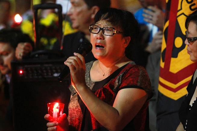 Yao Jia Zhen talks about her nephew Zexiang Wang during a candle light vigil Thursday, Sept. 20, 2012 for people who were killed and injured when Gary Lee Hosey Jr. drove into a bus stop a week earlier. Wang, a 19-year-old student from China, is still paralyzed and in critical condition.