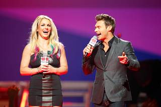 Britney Spears and Ryan Seacrest introduce a musical group during the 2012 iHeart Radio Music Festival at MGM Grand Garden Arena on Friday, Sept. 21, 2012.