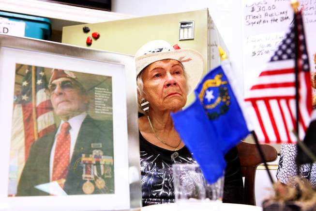 Bettyann Bates, of Pahrump, sits with a photo of her husband Joseph, a POW/MIA in WWII who was eventually rescued and who passed away in February 2012, during the National POW/MIA Day Ceremony  at the Veterans of Foreign Wars Post #10047 in Las Vegas on Friday, September 21, 2012.