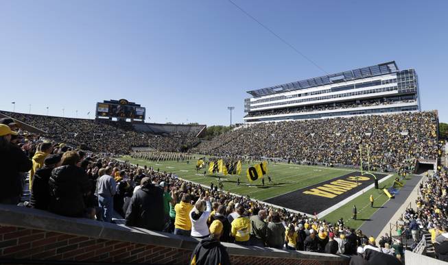Fans in Kinnick Stadium cheer before an NCAA college football game between Iowa and Central Michigan, Saturday, Sept. 22, 2012, in Iowa City, Iowa. 