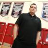 Findlay Prep basketball coach Todd Simon is seen in their gym before practice Wednesday, Sept. 19, 2012.