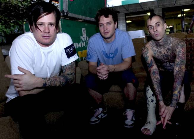 Members of Blink 182, Tom DeLonge, left, Mark Hoppus, center, and Travis Barker relax before their concert at the Tweeter Center in Mansfield, Mass., Tuesday, June 8, 2004. 