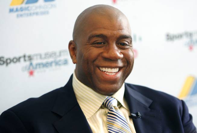 Basketball legend turned entrepreneur Magic Johnson tours the Sports Museum of America in New York, Friday, Nov. 21, 2008. Johnson was there to promote his new book, "32 Ways to be a Champion in Business". 
