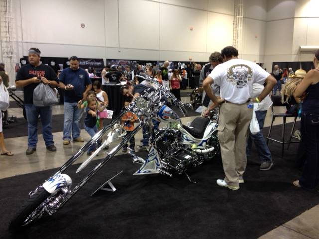 People take a closer look at Vaughn Spurlock's entry at the Artistry in Iron competition at Las Vegas Bike Fest on Saturday, Sept. 29, 2012.
