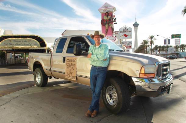 Colorado resident Darrell Diamond stands with his truck and spousal plea on the Strip Thursday, Oct. 4, 2012.