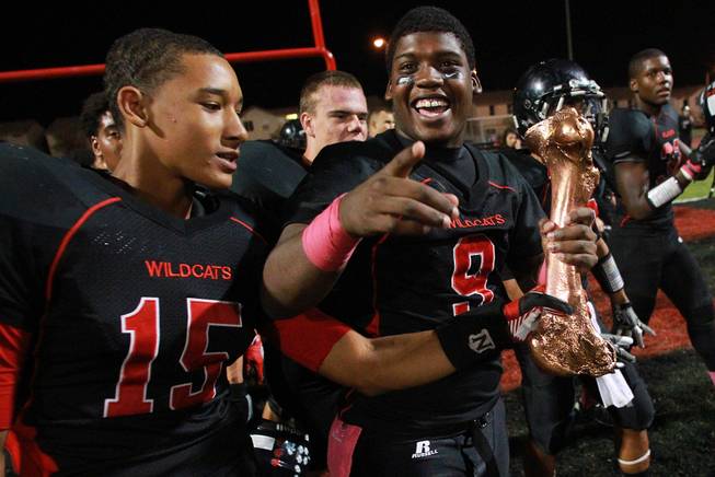 Las Vegas's Joshua Mayfield, left, and D'Anthony Wade celebrate beating Rancho in their annual "Bone Game" Friday, Oct. 5, 2012. Las Vegas won 45-0 for their 17th consecutive win in the series.