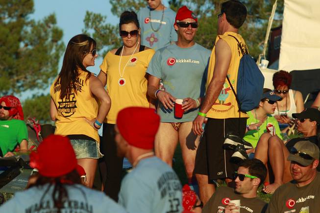 Competitors socialize between games during the World Adult Kickball Association Founders Cup Saturday, Oct. 6, 2012.
