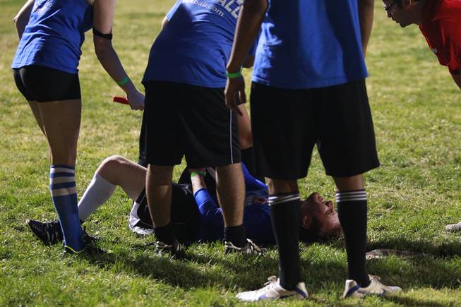 A player from Sofa King Good in North Hollywood collapses with a cramp during the World Adult Kickball Association Founders Cup Saturday, Oct. 6, 2012.