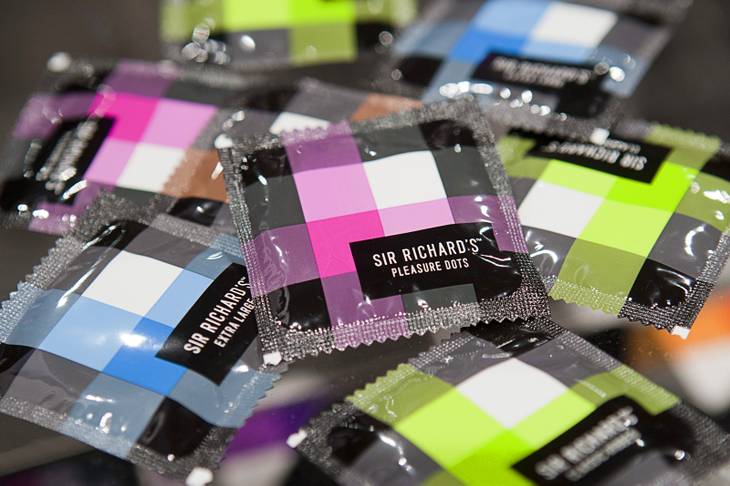 Sir Richard's condoms are displayed at the Ferrero booth during the annual National Association of Convenience Stores (NACS) trade show at the Las Vegas Convention Center Monday, Oct. 8, 2012. The condoms, in classic, ribbed, ultra thin and with pleasure dots, are made of 100% natural latex, vegan-certified, lubricated and free of spermacide.