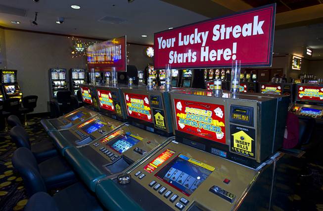 Old video poker machines that accept coins are shown on a "Vintage Vegas" casino floor at the D Las Vegas in downtown Las Vegas Tuesday, Oct. 9, 2012. The casino, formerly Fitzgeralds, is celebrating it's rebranding and renovation with festivities this weekend.