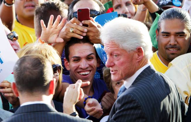 Former President Bill Clinton greets the crowd after a rally at the Springs Preserve in Las Vegas on Tuesday, October 9, 2012.