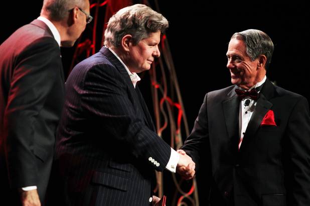 Bob Boughner, left, is honored during the Palladium Society Awards Ceremony and shakes hands with the chairman of the UNLV Foundation Board of Trustees John O'Reilly, right, during the UNLV Foundation Annual Dinner at the Bellagio in Las Vegas on Tuesday, October 9, 2012.