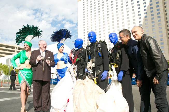 From left to right: former Mayor of Las Vegas Oscar Goodman and his showgirls, The Blue Man Group, and founders of Blue Man Group Phil Stanton and Chris Wink on the opening day of their new show at the Monte Carlo, Wednesday Oct. 10, 2012.