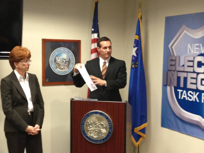 Nevada Secretary of State Ross Miller discusses voter registration fraud at a press conference Thursday, Oct. 11, 2012, in Las Vegas. Miller said that despite numerous complaints, his office has found no evidence of widespread, coordinated voter registration fraud.