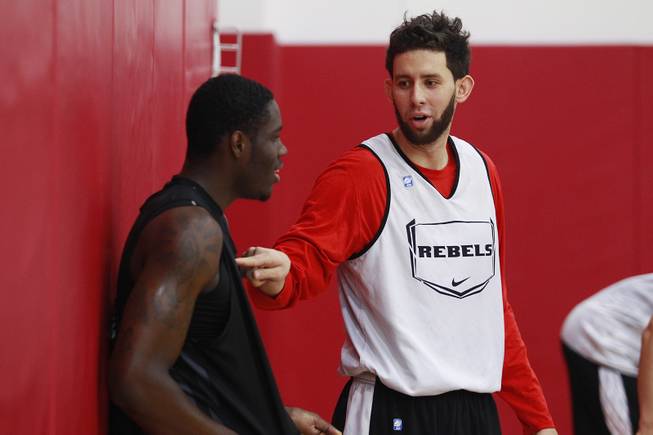 UNLV forward Carlos Lopez playfully pokes teammate Anthony Bennett during the Rebels first official practice Friday, Oct. 12, 2012.