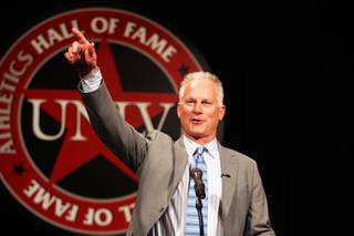 Kenny Mayne accepts the Silver Rebel Award during the UNLV Athletics Hall of Fame Ceremony at the South Point Casino on Friday, October 12, 2012.