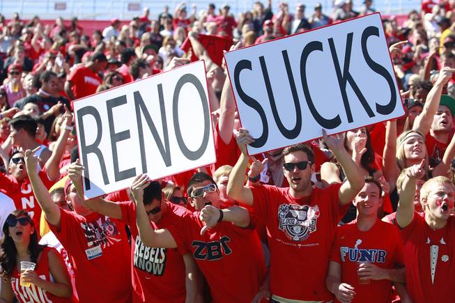 UNLV fans yell as the UNR football team takes the ...