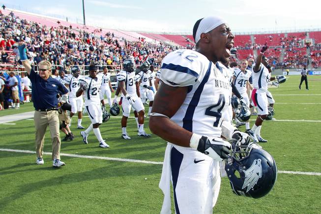 UNR linebacker DeAndre Boughton celebrates as time expires in their game against UNLV Saturday, Oct. 13, 2012 at Sam Boyd Stadium. UNR came from behind and won the game, for the eighth consecutive time, 42-37.