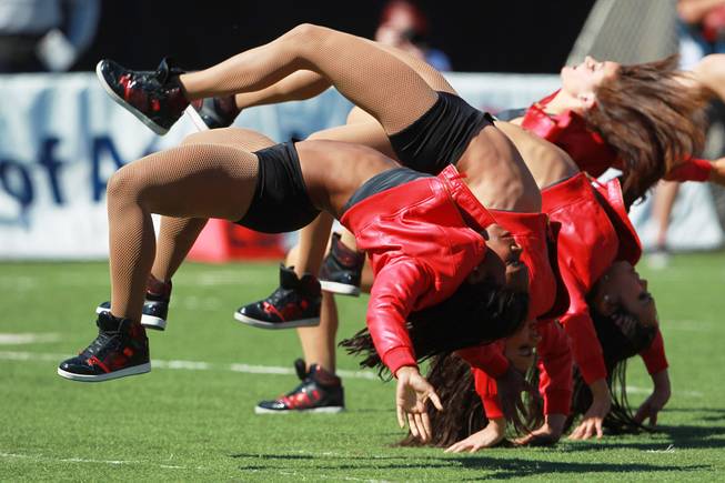 The UNLV Rebel Girls perform during a time out in their game against UNR Saturday, Oct. 13, 2012 at Sam Boyd Stadium.
