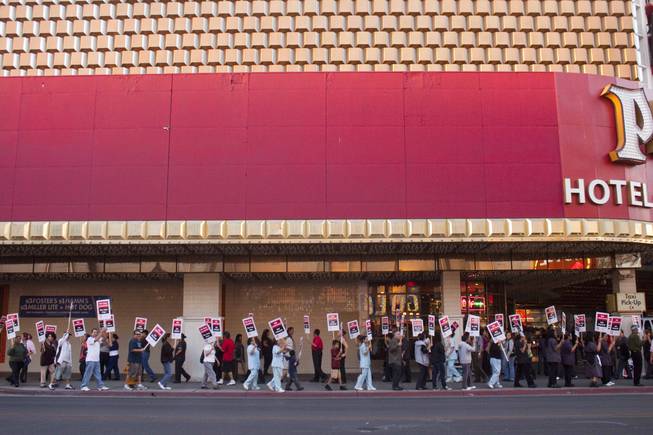 Culinary Workers Union Local 226 members spread out to each of the nine casinos in downtown Las Vegas to protest for health and retirement benefits on Saturday. 