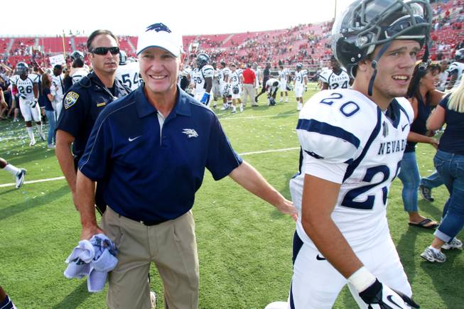 UNR coach Chris Ault walks off the field after defeating UNLV 42-37 Oct. 13, 2012. Ault announced on December 28, 2012 that he would be stepping down after 28 years at the Wolf Pack helm.
