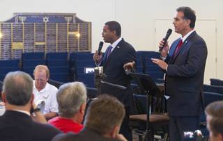 Candidates for the state's 4th Congressional District Steven Horsford, left, and Danny Tarkanian try to talk at the same time doing a debate at Temple Sinai of Las Vegas in Summerlin Sunday, Oct. 14, 2012. The temple's Men's Club sponsored the debate.