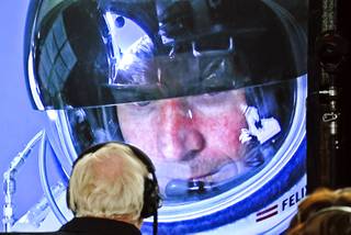 In this image provided by Red Bull, pilot Felix Baumgartner of Austria seen in a screen at mission control center in the capsule during the final manned flight for Red Bull Stratos in Roswell, New Mexico October 14, 2012.