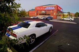 Cars are shown in the parking lot during a Breakfast Club of Automotive Enthusiasts weekly meeting at the T-Bird Restaurant and Lounge, 9465 South Eastern Avenue, Wednesday morning, Oct. 17, 2012. Ford Mustangs and a Shelby GT500 Super Snake are parked next to the restaurant. At left is a 2011 Dodge Challenger SRT Special Edition.