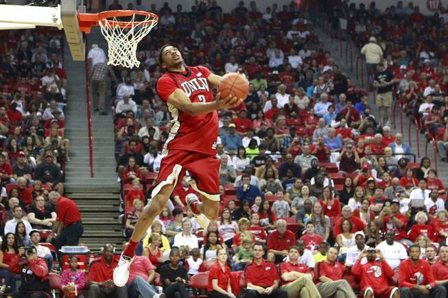 UNLV forward Khem Birch soars to the hoop during the dunk contest at the team's First Look scrimmage Thursday, Oct. 18, 2012, at the Thomas & Mack Center.