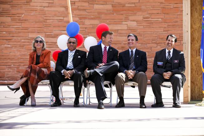 From left, Former Rep. Dina Titus, Rev. Raymond Giddens, senior of the Unity Baptist Church, Sen. Dean Heller, Rep. Joe Heck and Nat Hodgson, executive director of the Southern Nevada Homebuilders Association, wait to address a homeownership rally at the Clark County Government Center Amphitheater Thursday, Oct. 18, 2012.