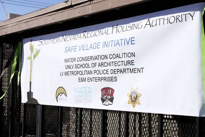 A banner showing the participants of the Safe Village Initiative is seen during a "Community Improvement Celebration" at Sherman Gardens on Wednesday, Oct. 24, 2012. The Sherman Gardens community will be undergoing outdoor renovations as part of a community improvement plan.