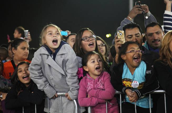 From left to right: Victoria Gonzales, 11, Emma Toledo, 9, Maribel Quezada, 14, Jacquilynn Quevedo, 5 and Izabella Quevedo, 6, sing along to Katy Perry's "Firework" at Barack Obama's rally at Doolittle Park Wednesday night, Oct. 24, 2012. They know every word.