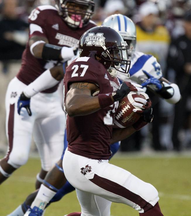 Mississippi State running back LaDarius Perkins (27) rushes past Middle Tennessee linebacker Ykeem Wells (52) for short yardage in the first quarter of an NCAA college football game in Starkville, Miss., Saturday, Oct. 20, 2012.