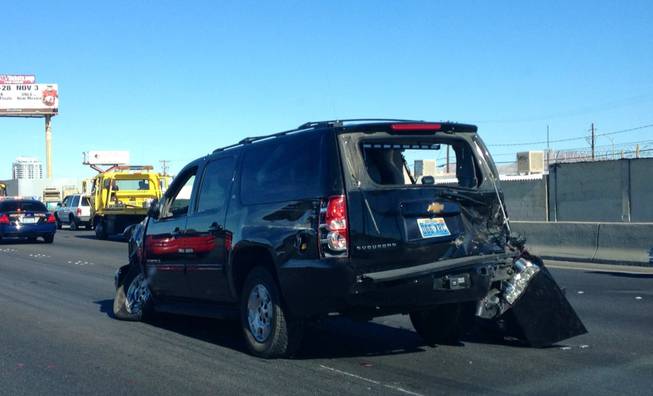 A Chevrolet Suburban sits wrecked on Interstate 15 north of Sahara Avenue on Friday, Oct. 26, 2012. The SUV was one of five vehicles in an accident involving U.S. Sen. Harry Reid's motorcade. It was not clear whether this was the vehicle carrying Reid.