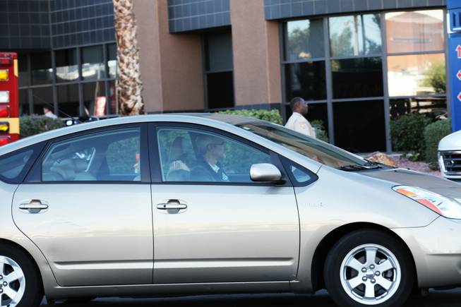 Rory Reid drives away from UMC hospital where father Sen. Harry Reid was being treated following a five car accident on I-15 near Sahara Ave on Friday, Oct. 26, 2012.