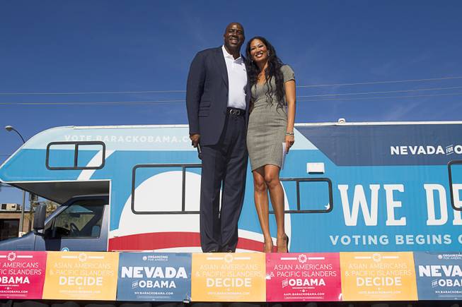 Basketball legend Earvin "Magic" Johnson and fashion designer and reality TV star Kimora Lee Simmons campaign for President Obama during an Asian American and Pacific Islander at the Chinatown Mall on Saturday, Oct. 27, 2012.