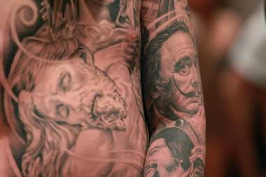 A man displays his tattoos, including Salvador Dali, at Mario Barth’s Biggest Tattoo Show On Earth at the Mirage Saturday, Oct. 27, 2012.
