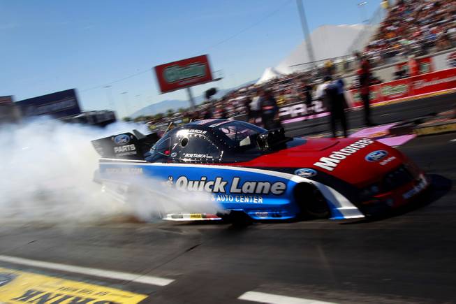 Bob Tasca III smokes his tires during the 12th Annual Big O Tires Nationals NHRA drag race on The Strip at Las Vegas Motor Speedway Sunday, Oct. 28, 2012.