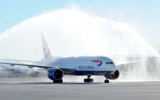 In this photo provided by the Las Vegas News Bureau, Officials welcomed British Airwaysi first flight from Londonis Gatwick Airport with the traditional water cannon salute at McCarran International Airport on October 29, 2012. 